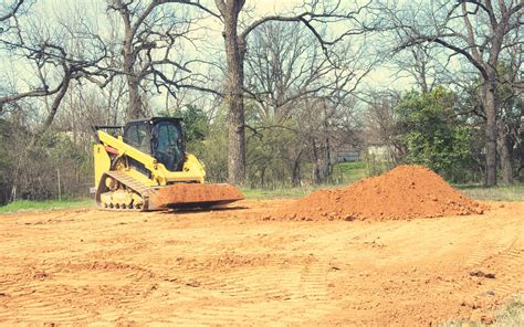 grading hill with skid steer|skid steer grading.